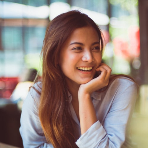woman smiling in coffee shop